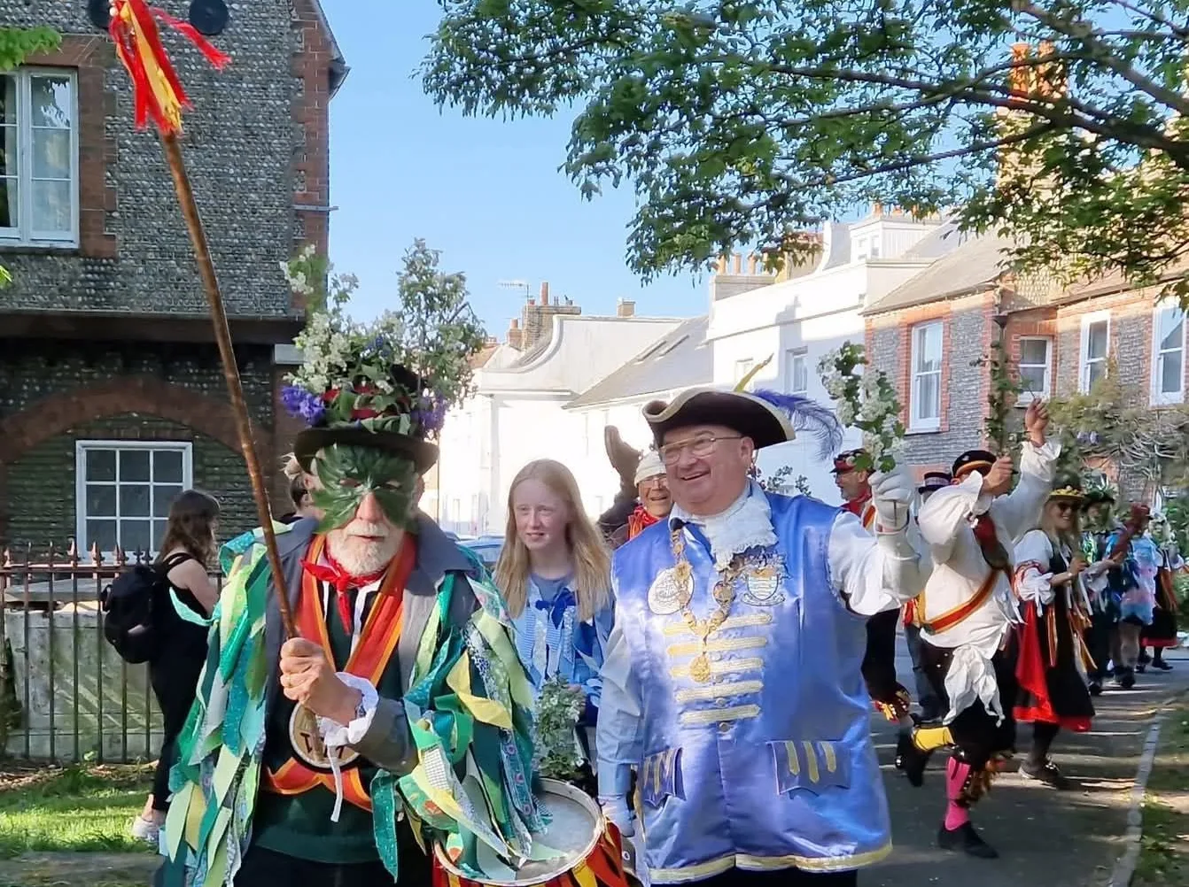 Bob Smytherman at the traditional May Day procession in Shoreham with Sompting Village Morris, in blue and gold with his bell.